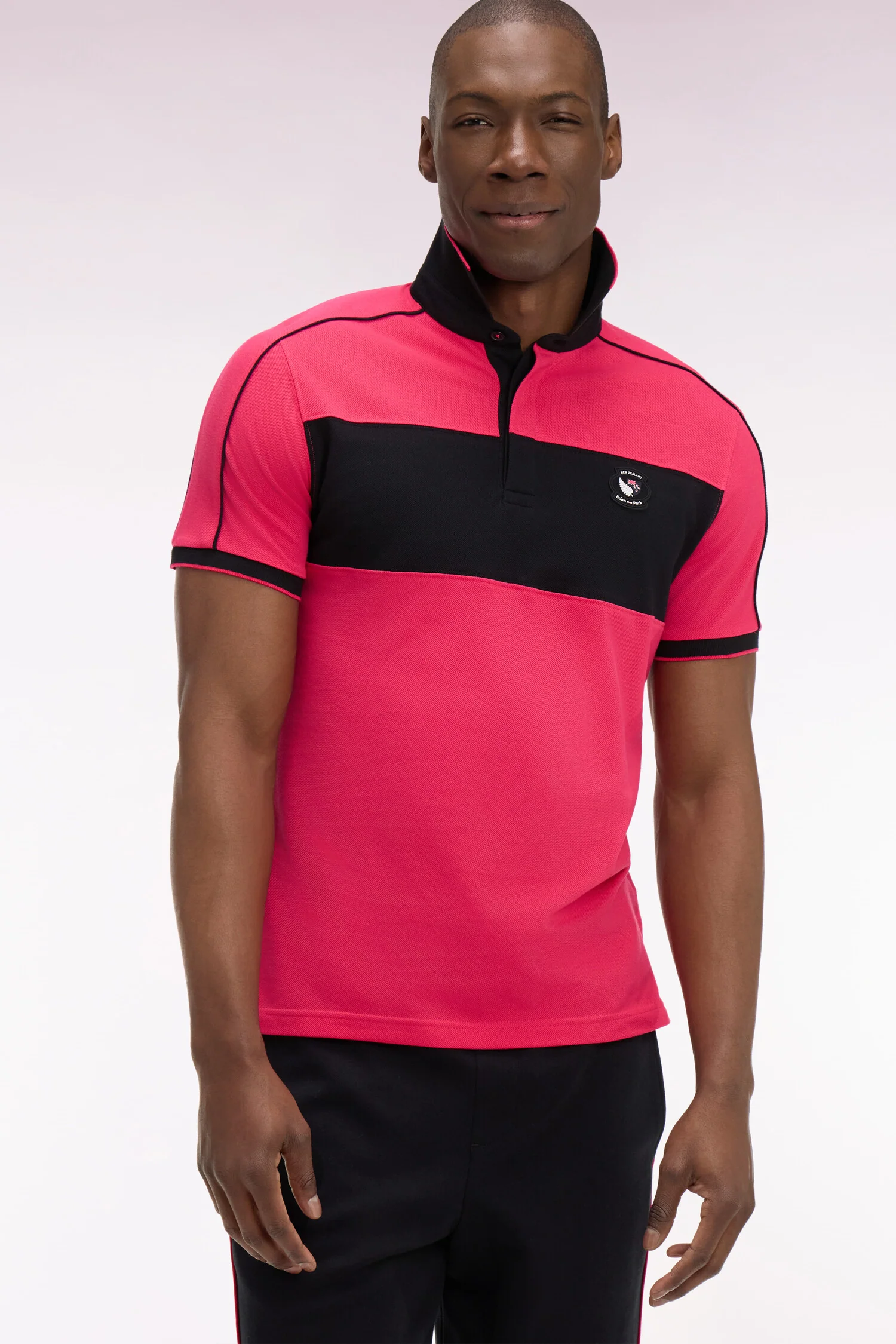 Polo Ă manches courtes en coton fuchsia et noir New Zealand coupe regular